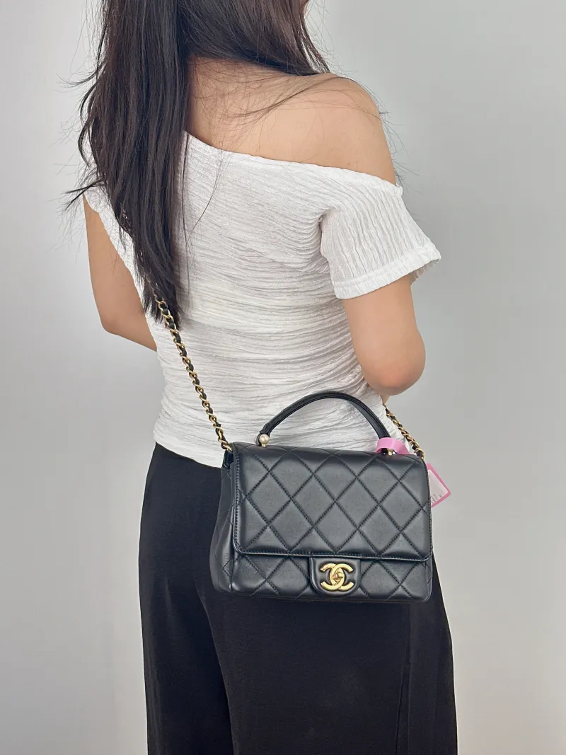 Chanel Crossbody Bag Pearl Crossbody Bag Black Lambskin One Size 21 × 7 × 15 cm — on-model view 1 of 2