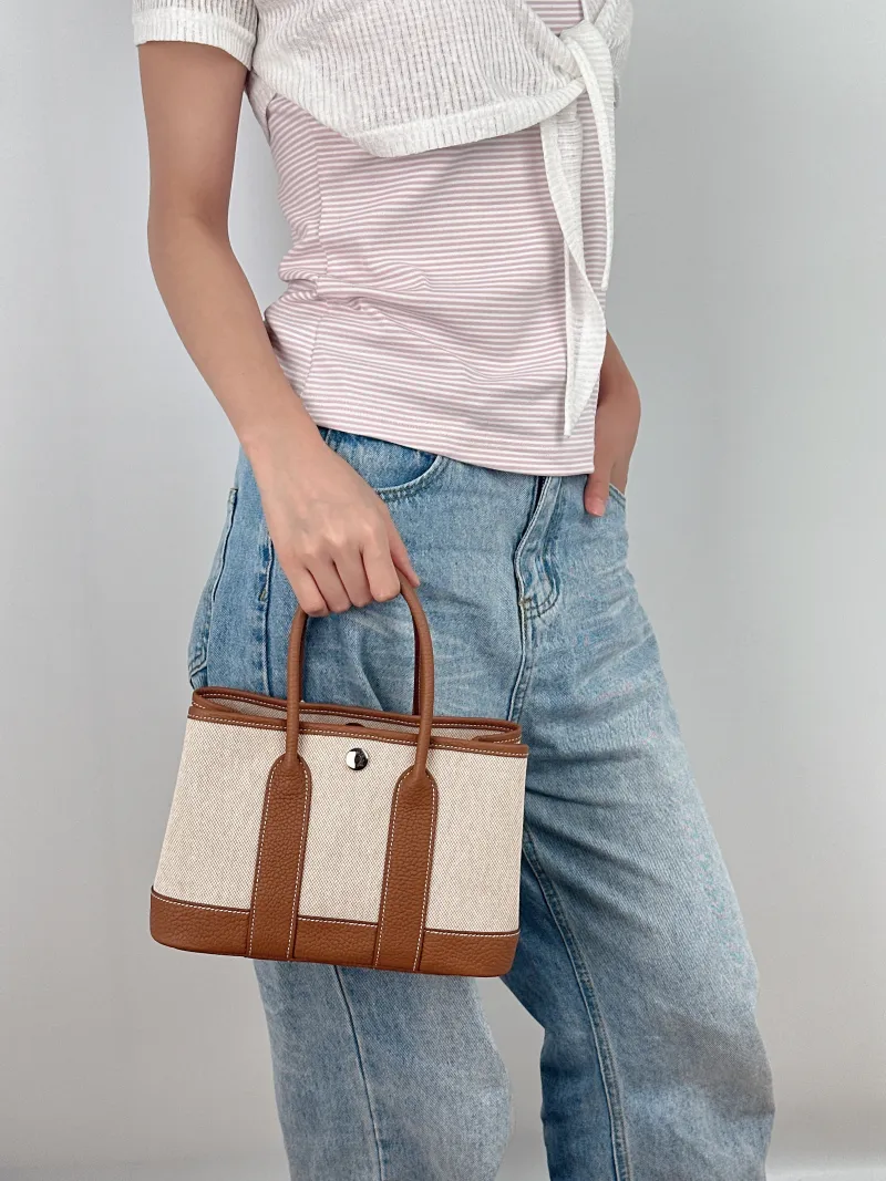 Hermès Top Handle Bag Neo Garden 23 Mini Canvas mini23 × 10 × 16 cm — on-model view 2 of 2