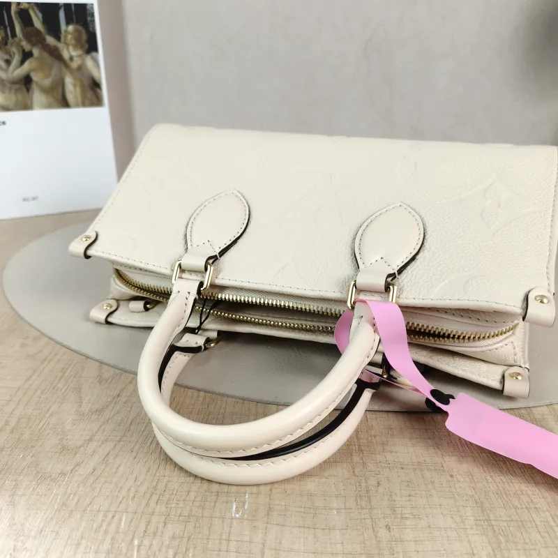Louis Vuitton Crossbody Bag Onthego East West Two Straps White Empreinte Embossed Calfskin Small 25 × 10 × 13 cm — detail view 4 of 13