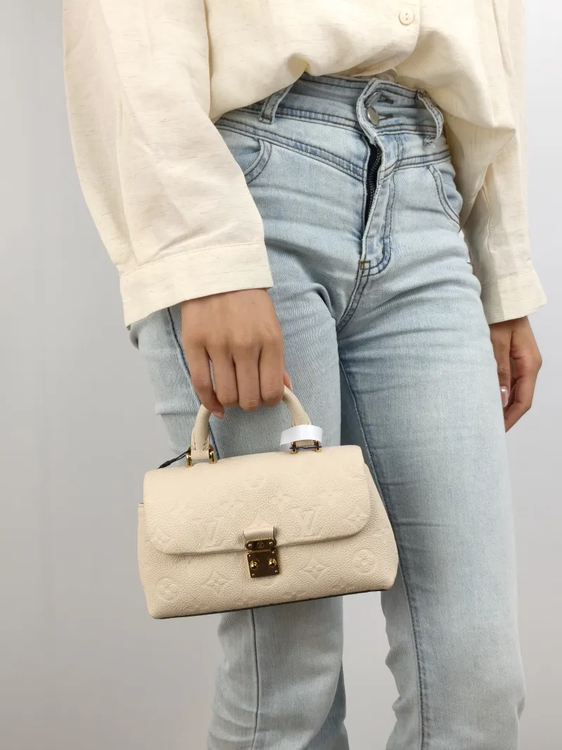 Louis Vuitton Crossbody Bag MADELEINE White Empreinte Embossed Calfskin nano 21 × 6 × 12.5 cm — on-model view 2 of 3