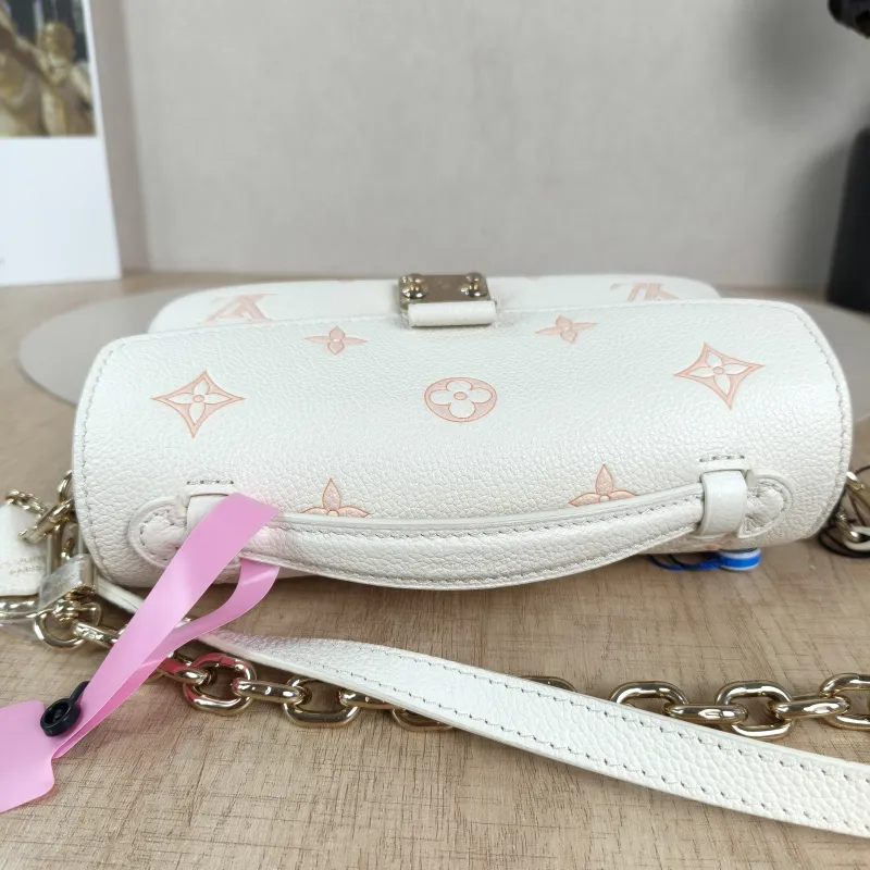 Louis Vuitton Crossbody Bag Pochette Métis East West White · Pink Monogram Empreinte Embossed Calfskin Small21.5 × 6 × 13.5 cm — detail view 8 of 13