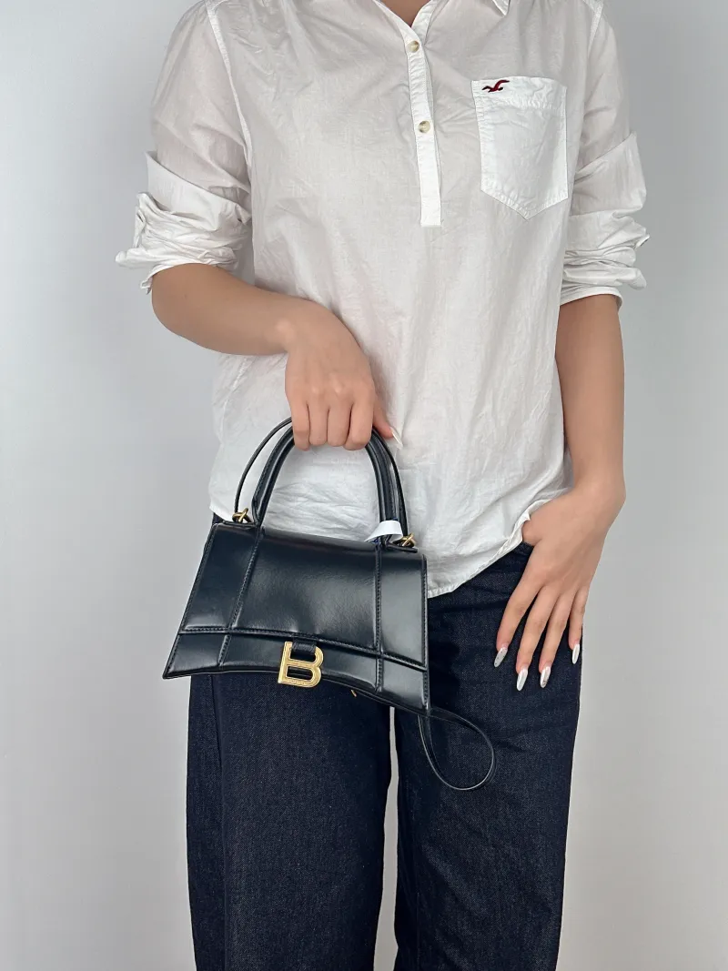 BALENCIAGA Crossbody Bag Hourglass Hourglass Bag Black Calfskin S 23 × 10 × 14 cm — on-model view 1 of 3