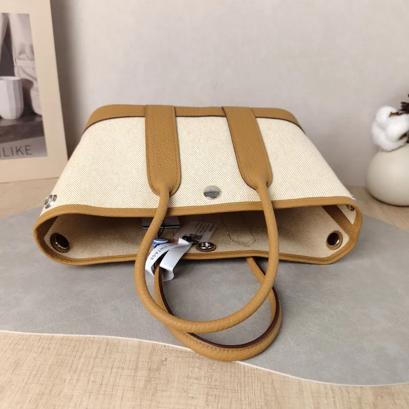Hermès Top Handle Bag Neo Garden 23 Mini Canvas · Negonda Calfskin Mini 23 × 10 × 16 cm G — detail view 1 of 10
