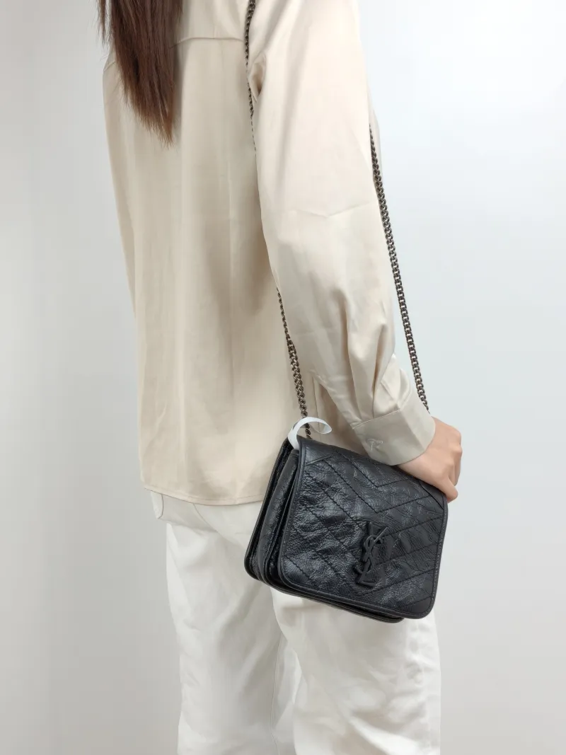 SAINT LAURENT Crossbody Bag Niki Chain Bagwoc Black Mini 19 × 5 × 16 cm — on-model view 1 of 2