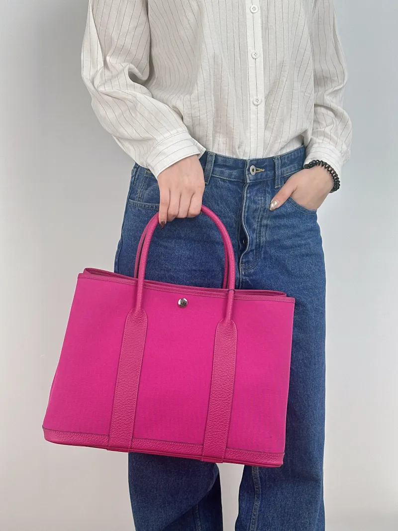 Hermès Top Handle Bag Garden Party 36 36 9I Canvas · Negonda Calfskin Large 36 × 17 × 26 cm Y — on-model view 1 of 2