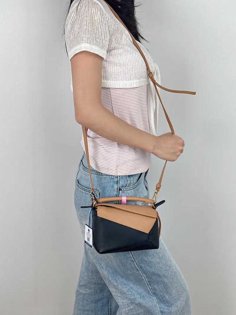 LOEWE Crossbody Bag Puzzle Black Brown Calfskin Mini 18 × 8 × 12.5 cm — on-model view 3 of 3