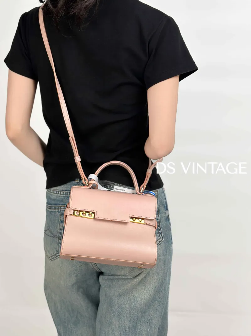 DELVAUX Top Handle Bag Tempete Top Handle Bag Pink Calfskin Small21.5 × 8.5 × 19.5 cm — on-model view 2 of 3