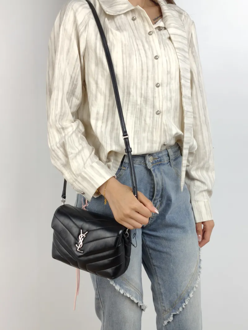 SAINT LAURENT Crossbody Bag LOULOU Black Calfskin Mini 20 × 7.5 × 14 cm — on-model view 1 of 2