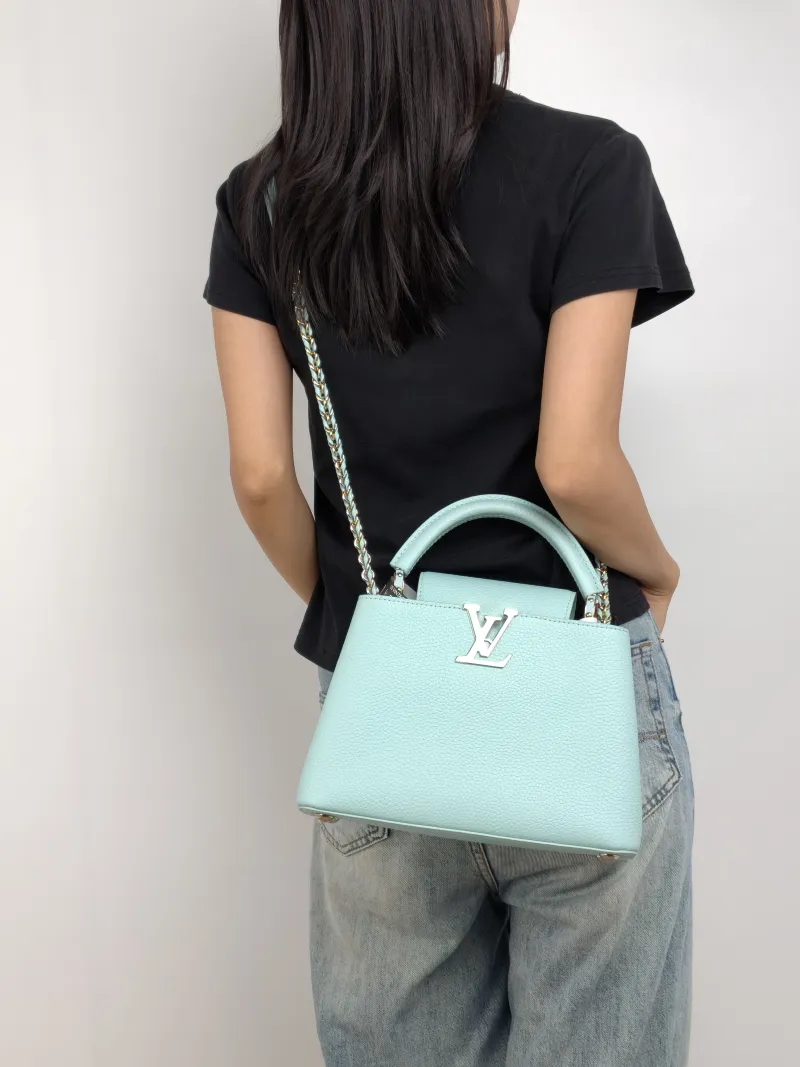 Louis Vuitton Top Handle Bag Capucines Blue Calfskin BB 27 × 9 × 17.5 cm — on-model view 2 of 3