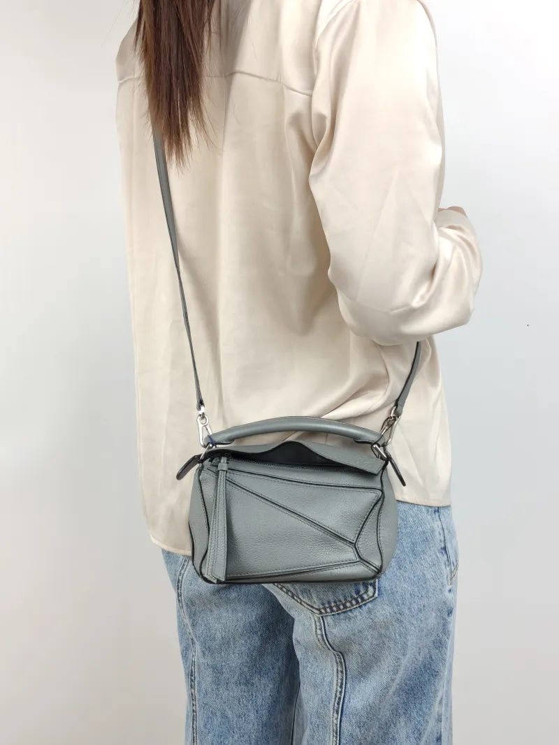 LOEWE Crossbody Bag Puzzle Grey Calfskin Mini 18 × 8 × 12.5 cm — on-model view 1 of 2