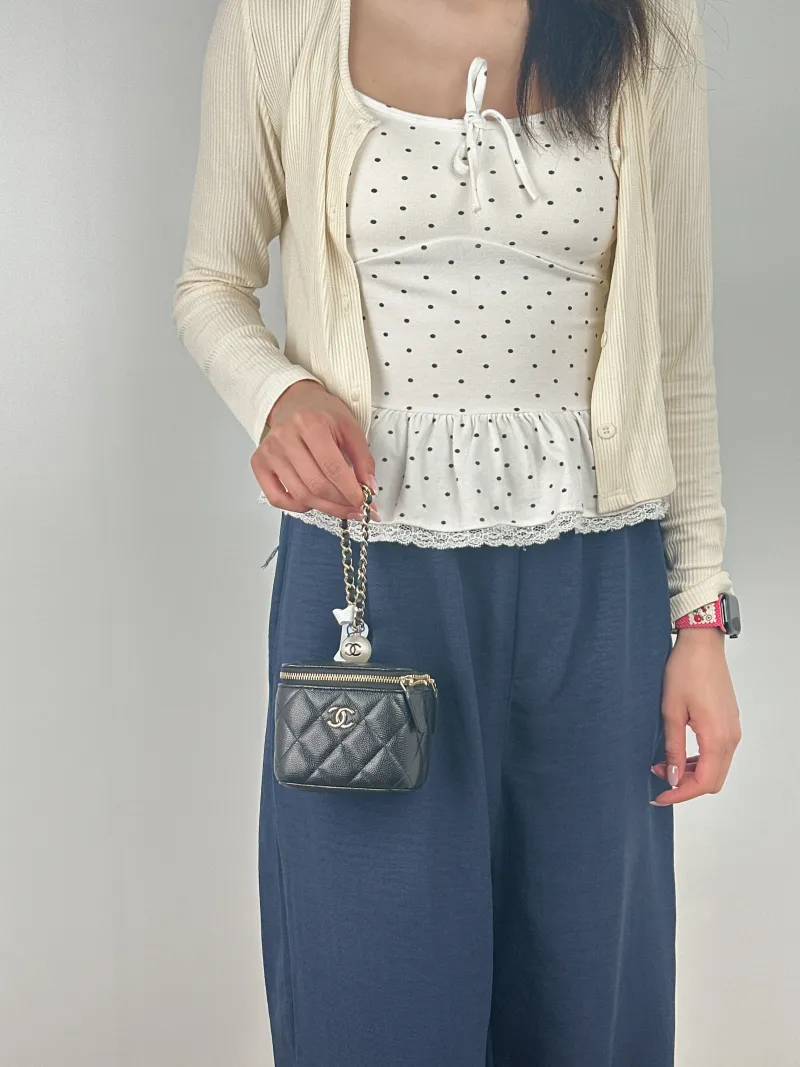 Chanel Top Handle Bag Edition Pearl Black Calfskin Mini 10 × 7 × 9 cm 31 — on-model view 1 of 2