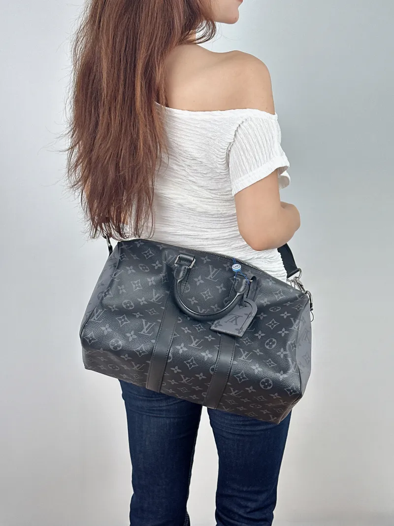 Louis Vuitton Crossbody Bag Keepall 35 Black PVC One Size 35 × 16 × 21 cm — on-model view 1 of 2