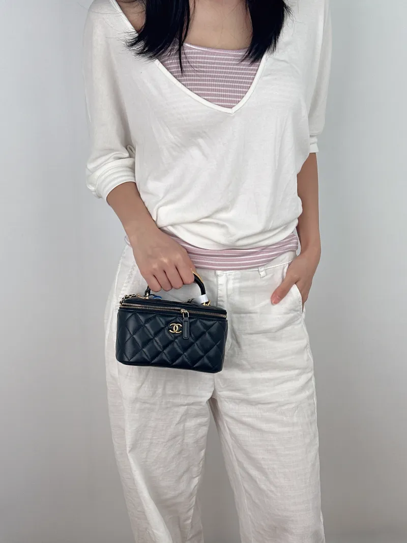 Chanel Crossbody Bag Edition Black with Gold-Tone Hardware Lambskin Mini 16 × 8 × 9.5 cm — on-model view 1 of 3