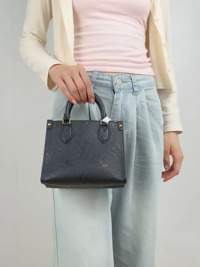 Louis Vuitton Crossbody Bag Onthego BB Black Empreinte Embossed Calfskin Monogram BB18 × 8.5 × 15 cm — on-model view 2 of 3