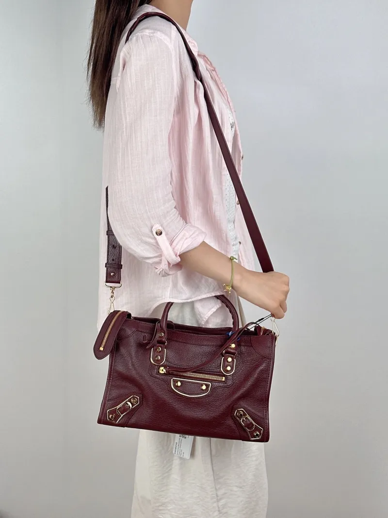 BALENCIAGA Crossbody Bag Classic City Red Lambskin Small30 × 10 × 21 cm — on-model view 1 of 3