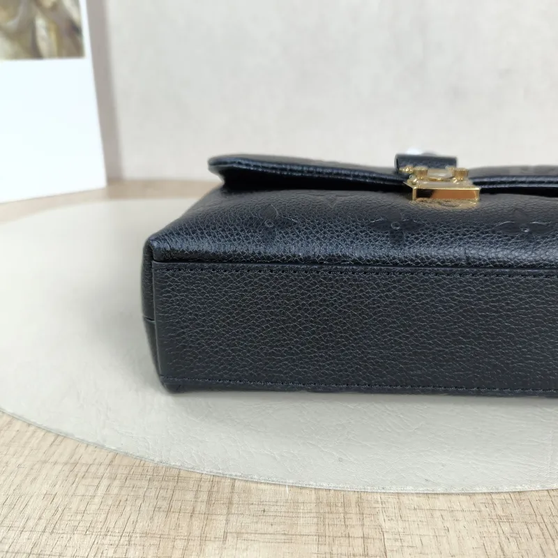 Louis Vuitton Crossbody Bag MADELEINE Black Monogram Empreinte Embossed Calfskin nano 21 × 6 × 12.5 cm — detail view 7 of 14