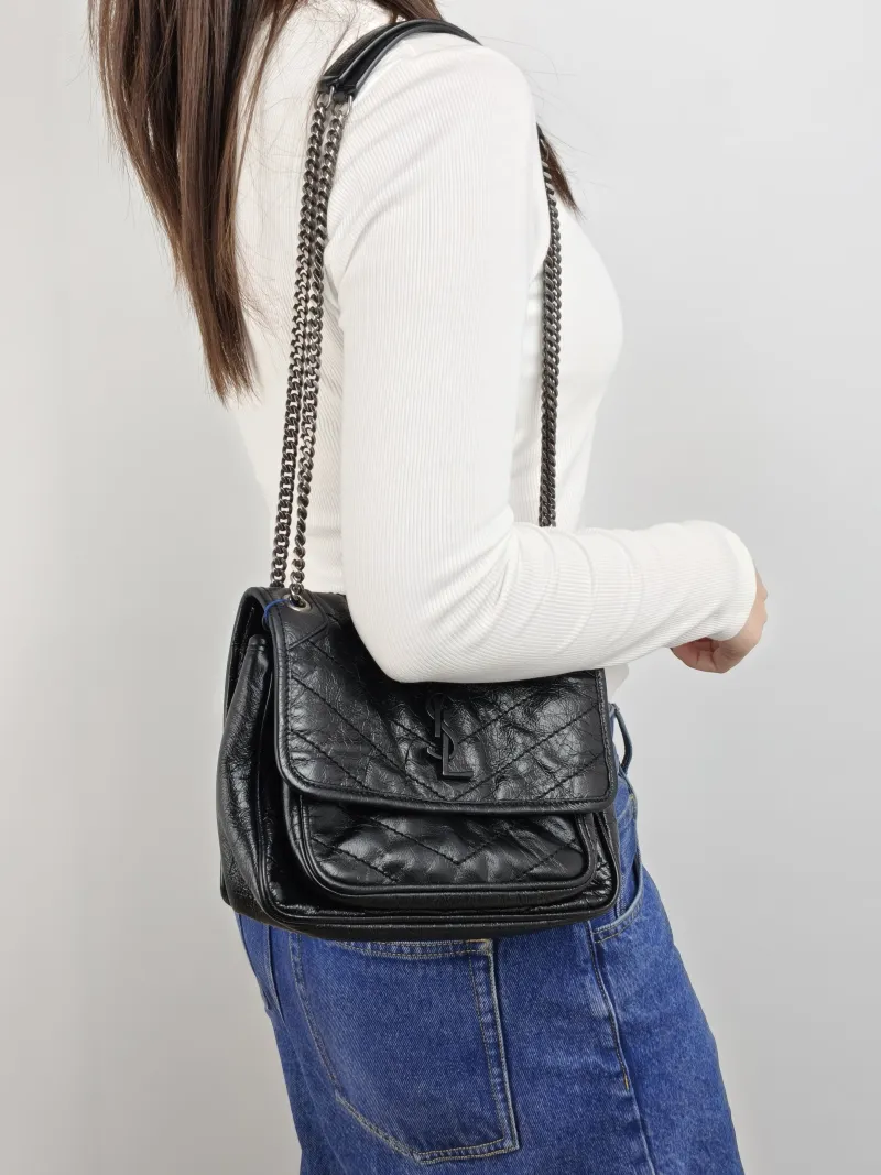 SAINT LAURENT Crossbody Bag Niki Black Waxed Leather Calfskin Small 21 × 7.5 × 16 cm — on-model view 2 of 2