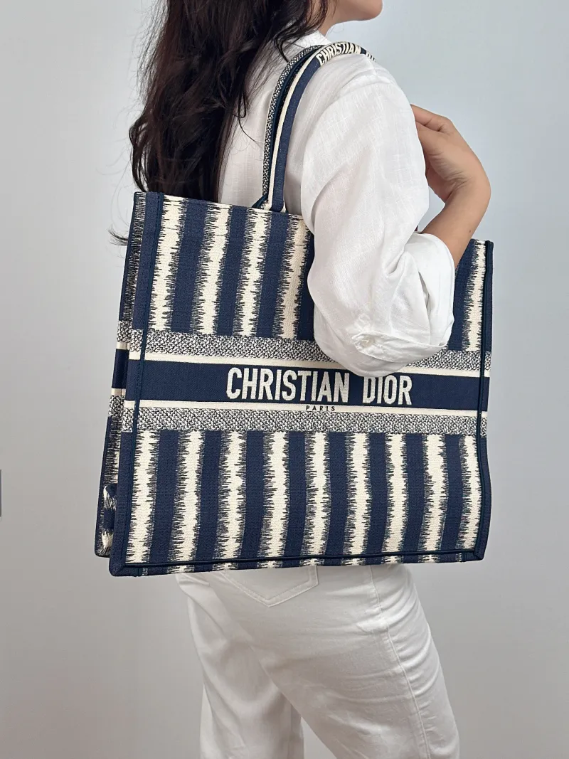 DIOR Top Handle Bag Book Tote Blue White Canvas Large 42 × 18.5 × 35 cm — on-model view 2 of 2