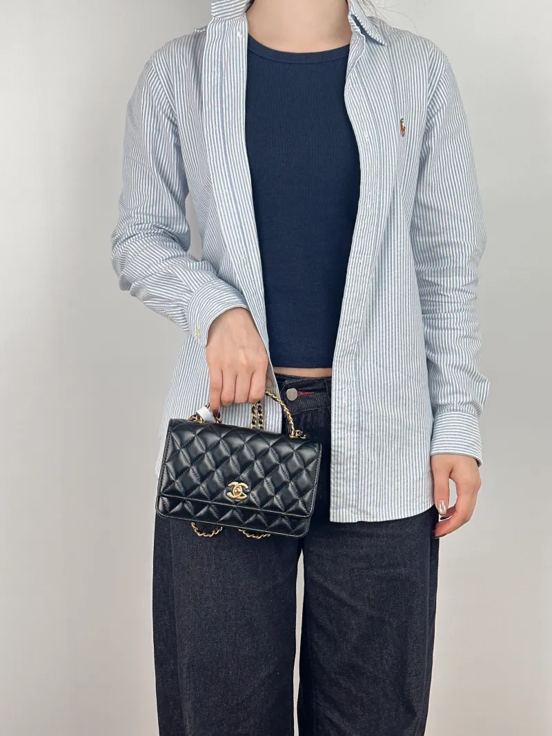 Chanel Crossbody Bag woc Black Lambskin Mini 19.2 × 3.5 × 12.3 cm — on-model view 2 of 3