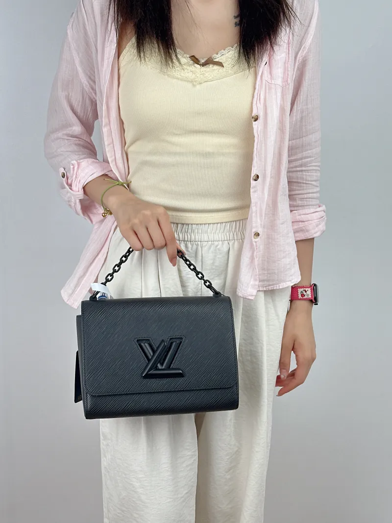 Louis Vuitton Crossbody Bag Twist Black Epi Embossed Calfskin Medium23 × 9.5 × 17 cm — on-model view 1 of 3