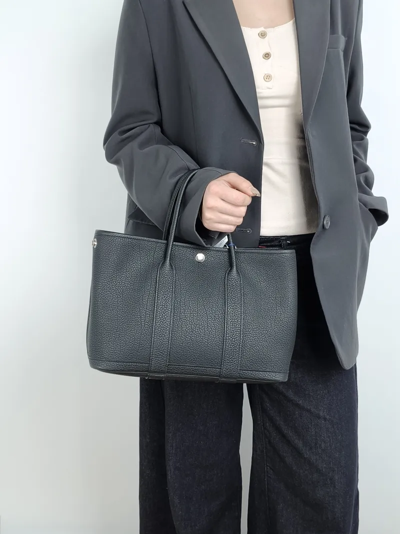 Hermès Top Handle Bag Garden Party 30 30 Black Negonda Calfskin Medium 30 × 13 × 21 cm G — on-model view 1 of 5