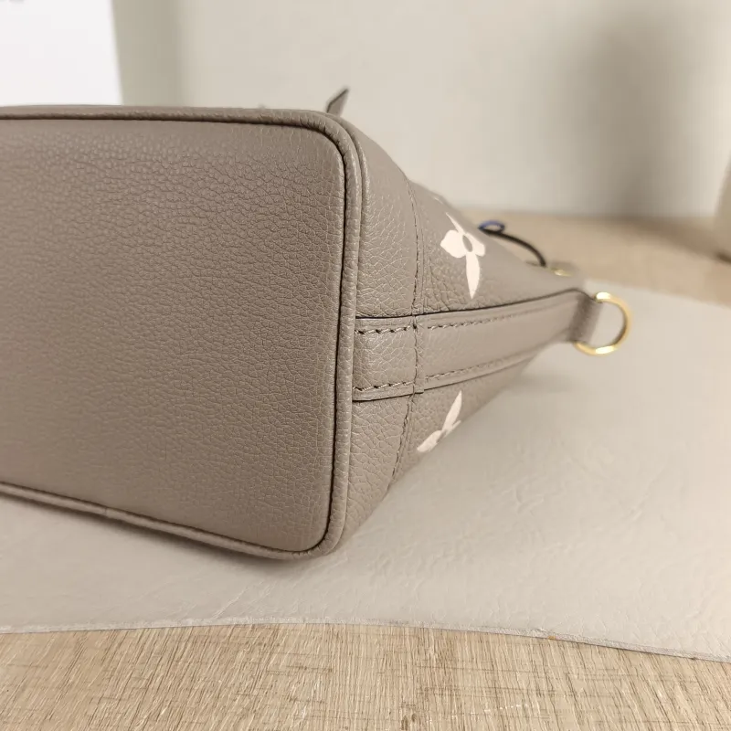 Louis Vuitton Crossbody Bag NANO NOÉ Bucket Bag Nano · White Empreinte Embossed Calfskin nano 13 × 10 × 16 cm — detail view 1 of 10