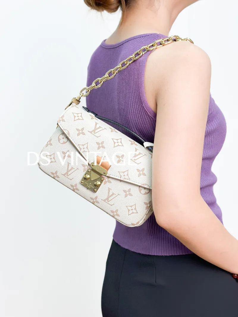 Louis Vuitton Crossbody Bag Pochette Métis East West PVC Small 21.5 × 6 × 13.5 cm — on-model view 4 of 4