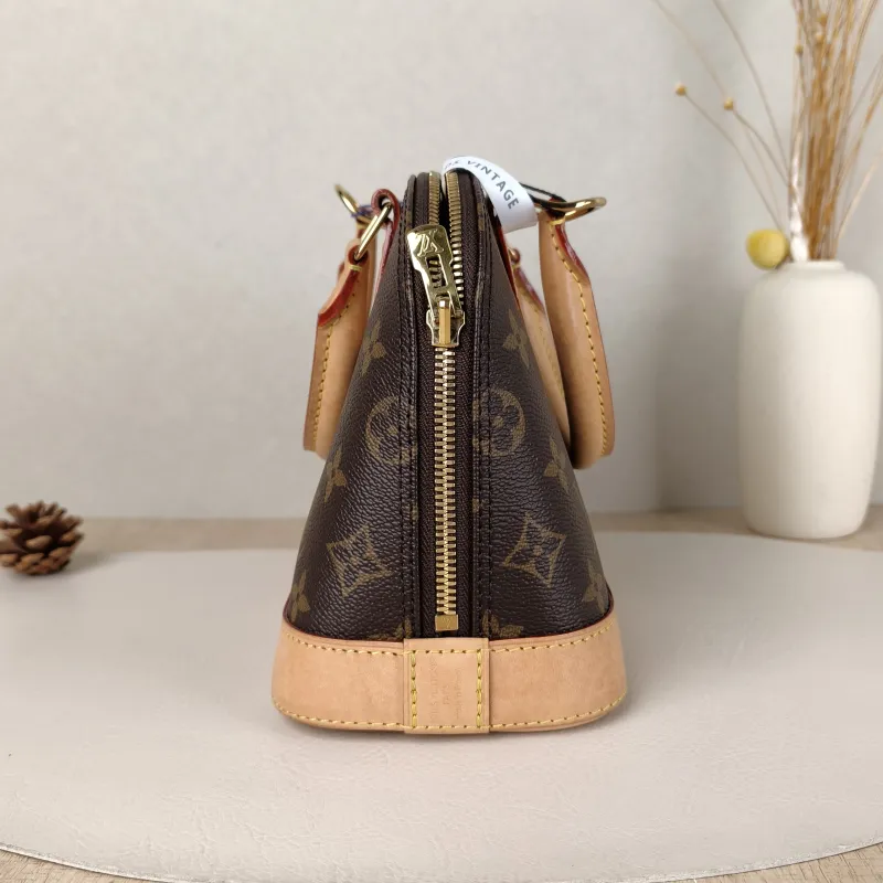 Louis Vuitton Crossbody Bag Alma BB Monogram PVCBB23.5 × 11.5 × 17.5 cm — detail view 10 of 14