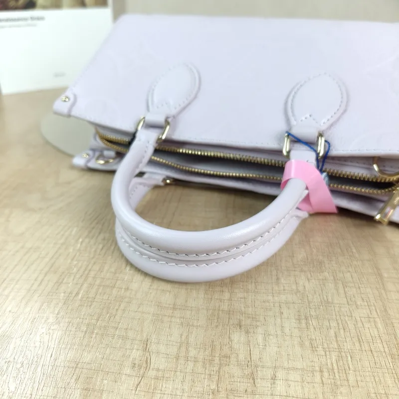 Louis Vuitton Crossbody Bag Onthego East West Two Straps Empreinte Embossed Calfskin Small 25 × 10 × 13 cm — detail view 6 of 12