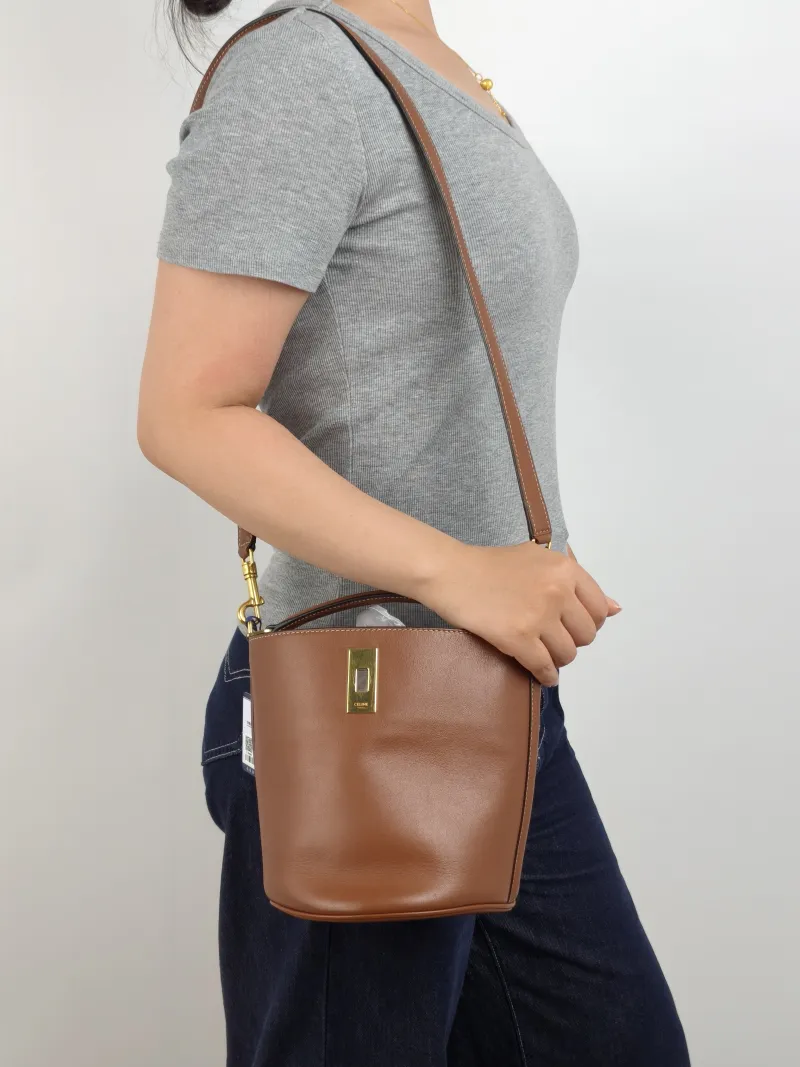 CELINE Crossbody Bag Bucket 16 Bucket Bag Caramel Calfskin Small 16 × 16 × 18 cm — on-model view 1 of 3