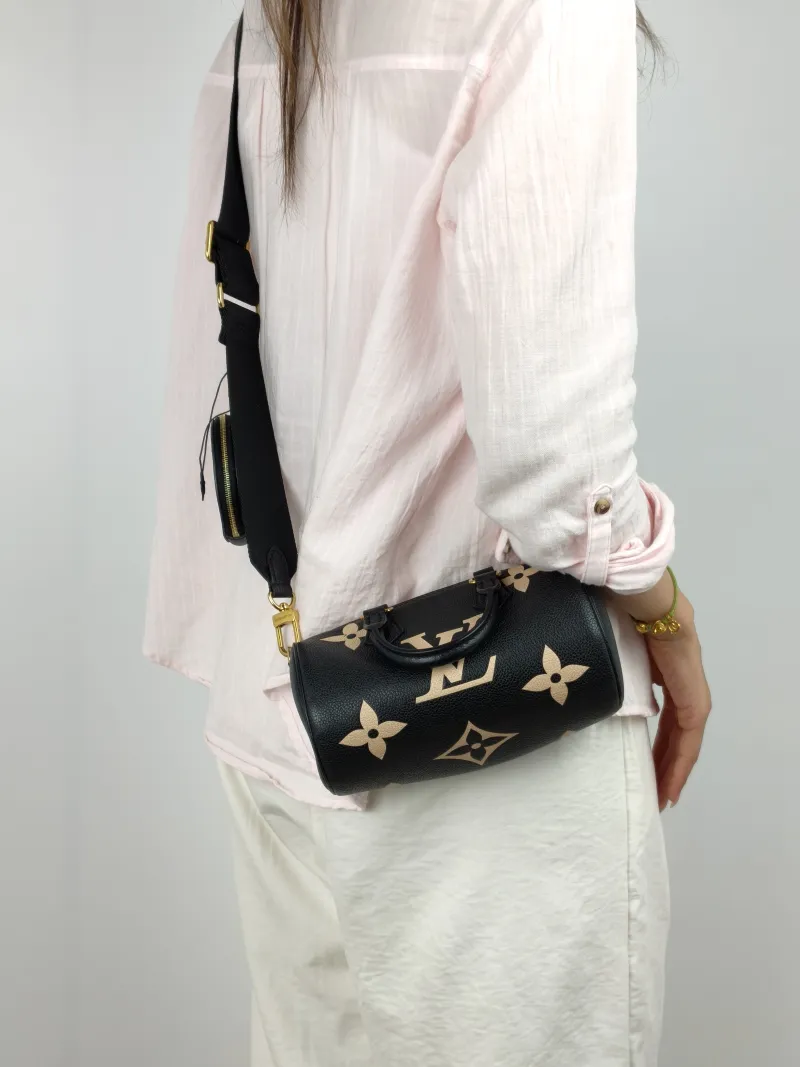 Louis Vuitton Crossbody Bag Papillon Black · White Monogram Empreinte Embossed Calfskin BB 20 × 10 × 10 cm — on-model view 1 of 3