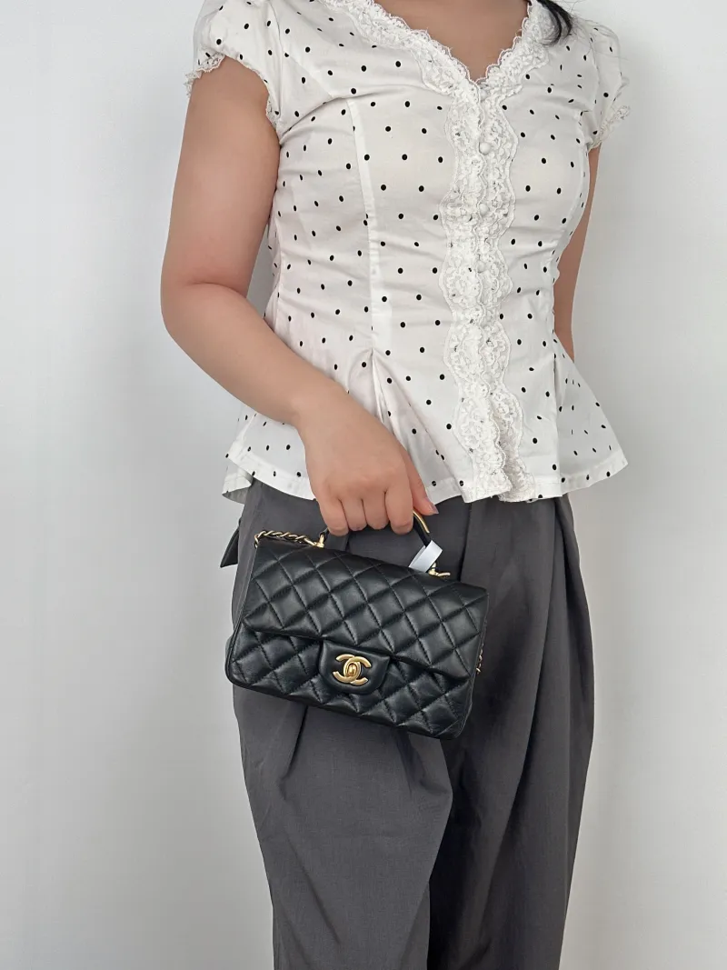 Chanel Crossbody Bag mini Black Lambskin mini20 × 6 × 12 cm — on-model view 3 of 3