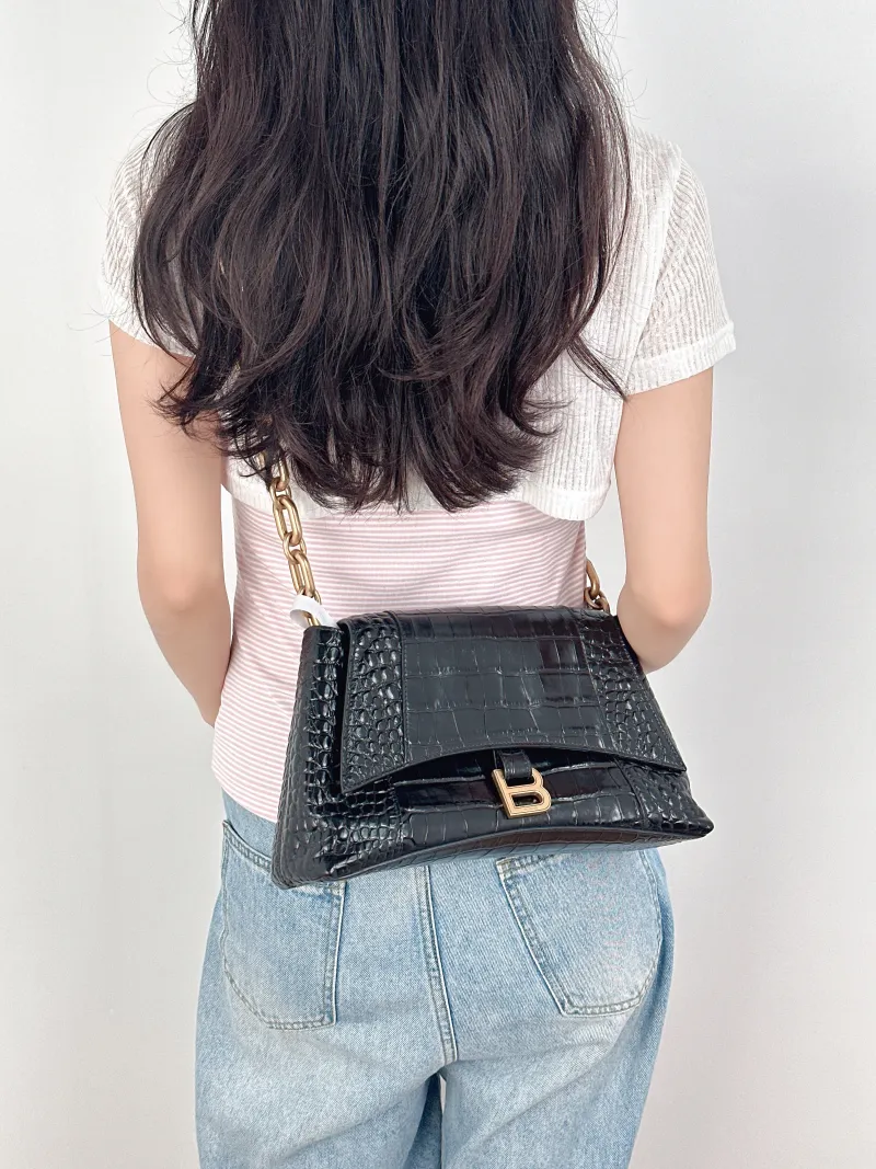 BALENCIAGA Shoulder Bag DOWNTOWN Black Calfskin Small30 × 10 × 17.5 cm — on-model view 1 of 3