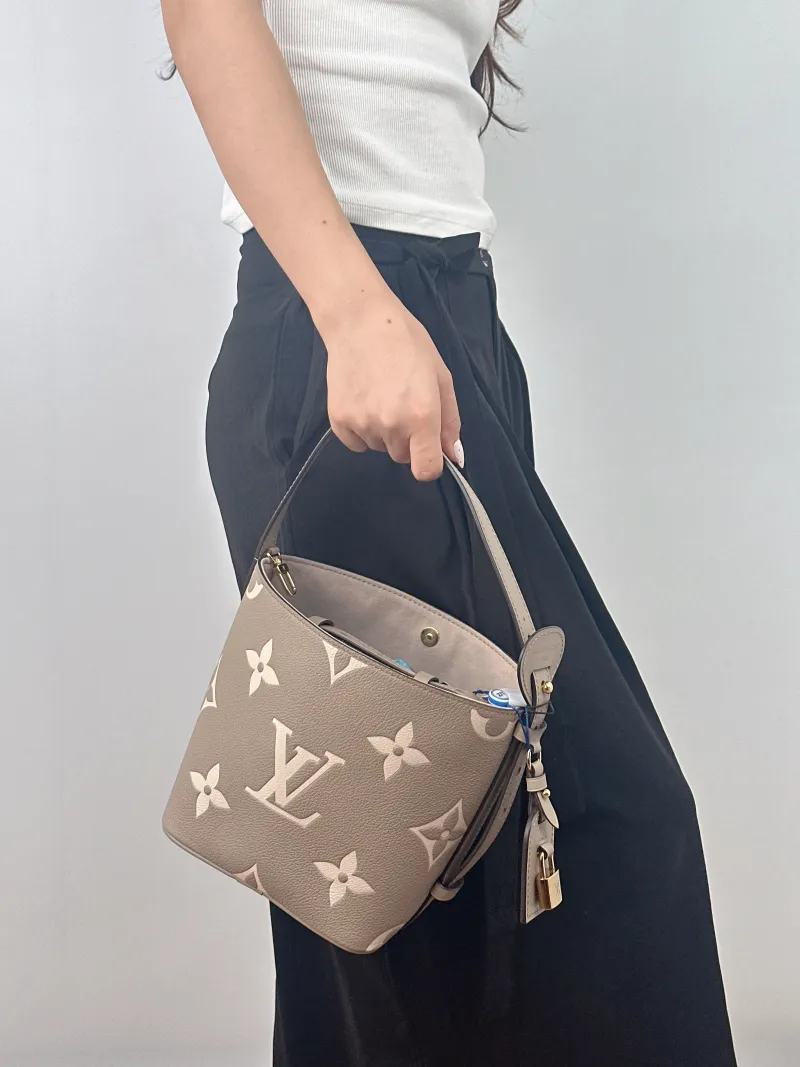 Louis Vuitton Top Handle Bag ALL IN BB · White Empreinte Embossed Calfskin BB 16 × 12 × 18 cm — on-model view 2 of 2