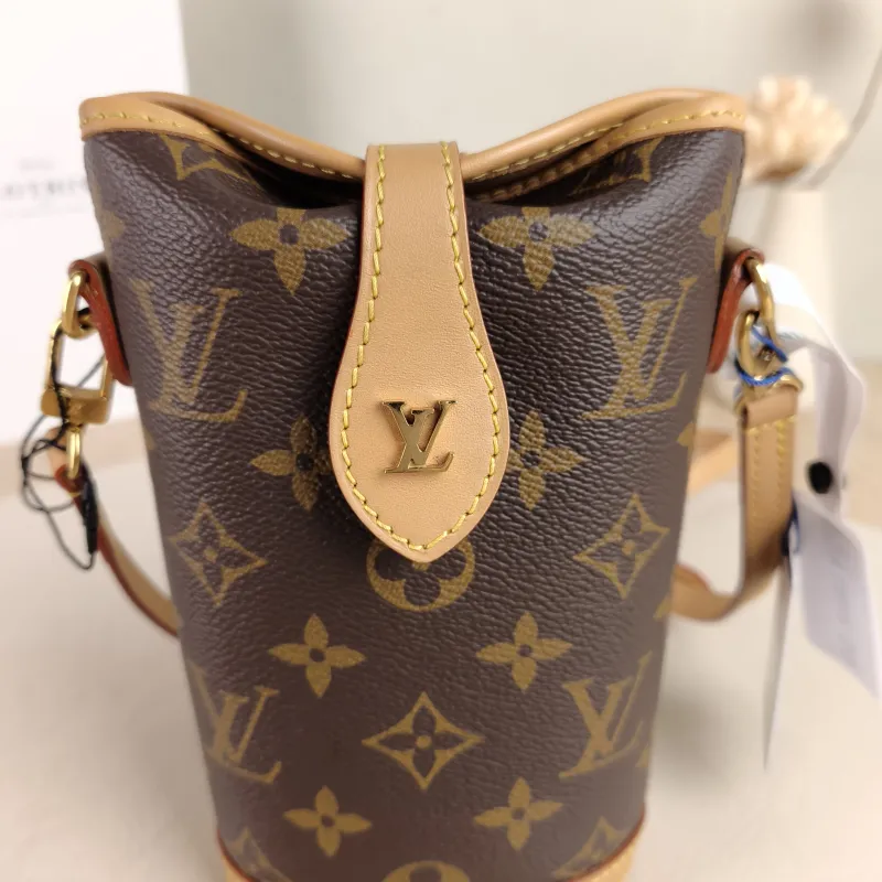 Louis Vuitton Crossbody Bag Fold Me Monogram PVC Mini 14.5 × 6.5 × 18 cm — detail view 1 of 10