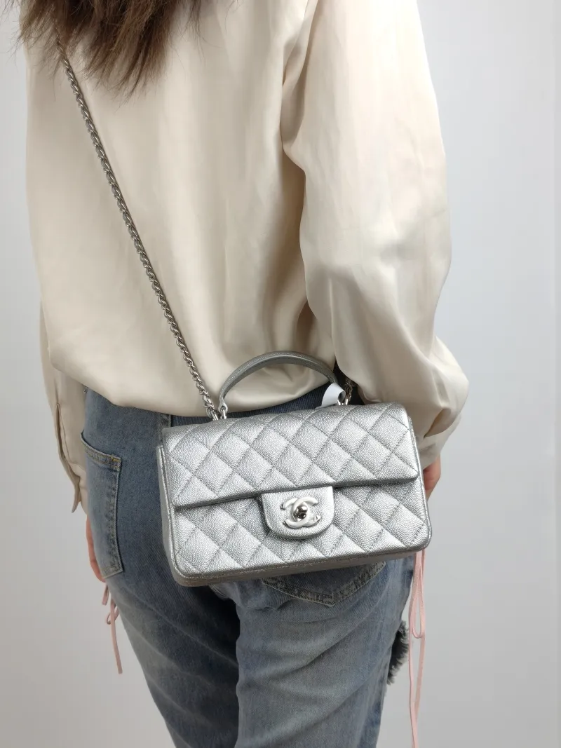 Chanel Crossbody Bag mini Silver Grained Calfskin mini 20 × 6 × 12 cm 30 — on-model view 2 of 3