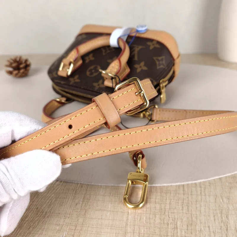 Louis Vuitton Crossbody Bag Alma Nano Monogram PVC nano 18 × 8 × 12 cm — detail view 1 of 9