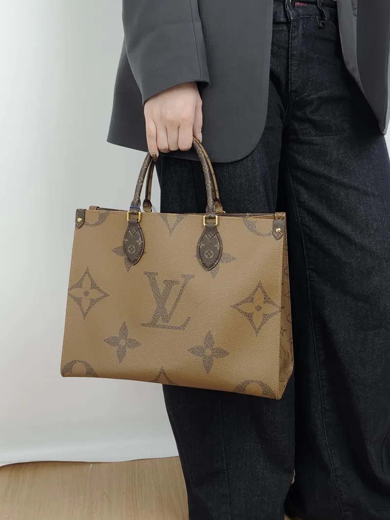 Louis Vuitton Shoulder Bag Onthego Medium Monogram PVC Medium 35 × 14 × 27 cm — on-model view 2 of 3