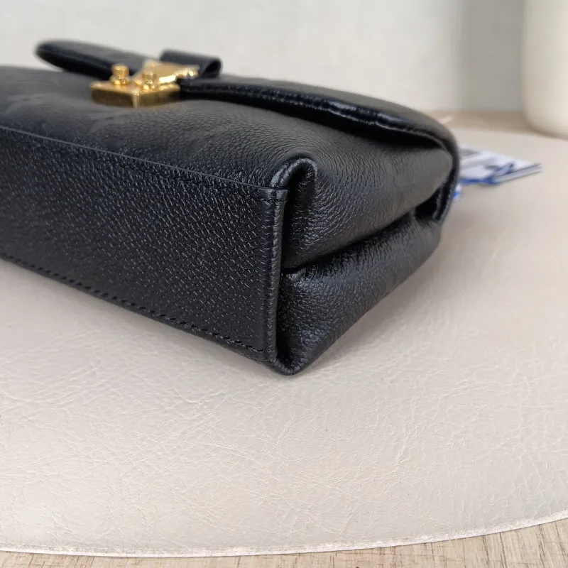 Louis Vuitton Crossbody Bag MADELEINE Black Monogram Empreinte Embossed Calfskin nano 21 × 6 × 12.5 cm — detail view 10 of 11