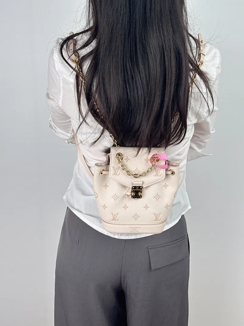 Louis Vuitton Backpack NANO NOÉ Backpack Beige Calfskin nano 15 × 10 × 19 cm — on-model view 2 of 2
