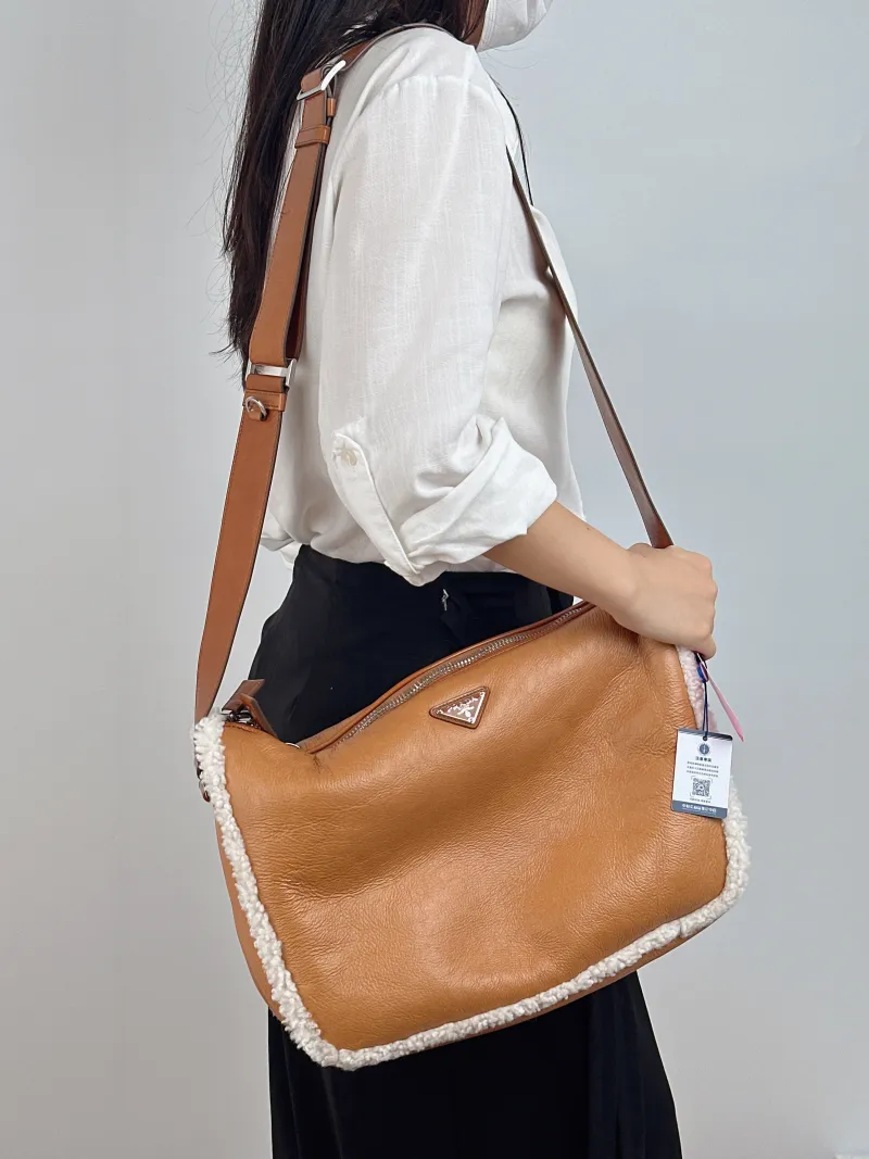 PRADA Crossbody Bag Messenger Bag Crossbody Bag Brown Lambskin · One Size 34 × 12 × 25 cm — on-model view 1 of 2