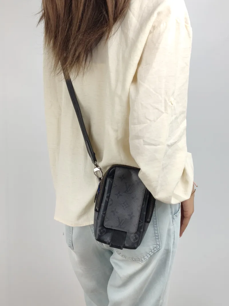 Louis Vuitton Crossbody Bag Double Phone Pouch Black Monogram PVC One Size 11 × 5 × 18 cm — on-model view 1 of 2
