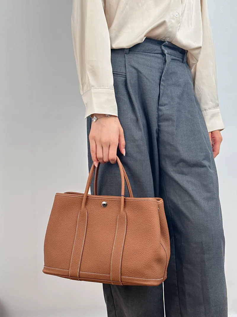 Hermès Top Handle Bag Garden Party 30 30 Negonda Calfskin Medium 30 × 13 × 21 cm K — on-model view 2 of 2