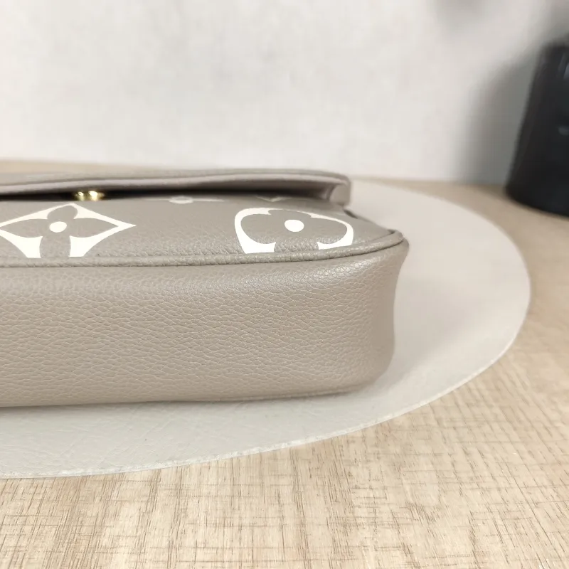 Louis Vuitton Crossbody Bag IVY Monogram Empreinte Embossed Calfskin Small 23.5 × 4.3 × 12 cm — detail view 1 of 13