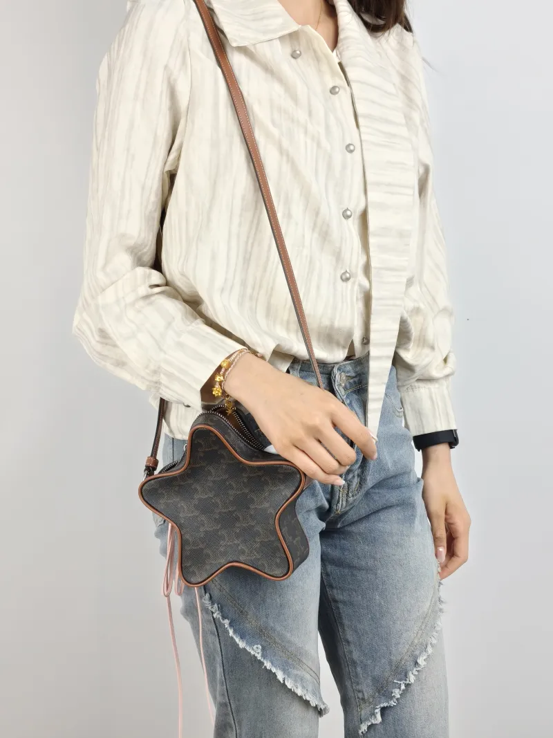 CELINE Crossbody Bag Etoile Monogram PVC Small 18 × 5 × 17 cm — on-model view 1 of 2