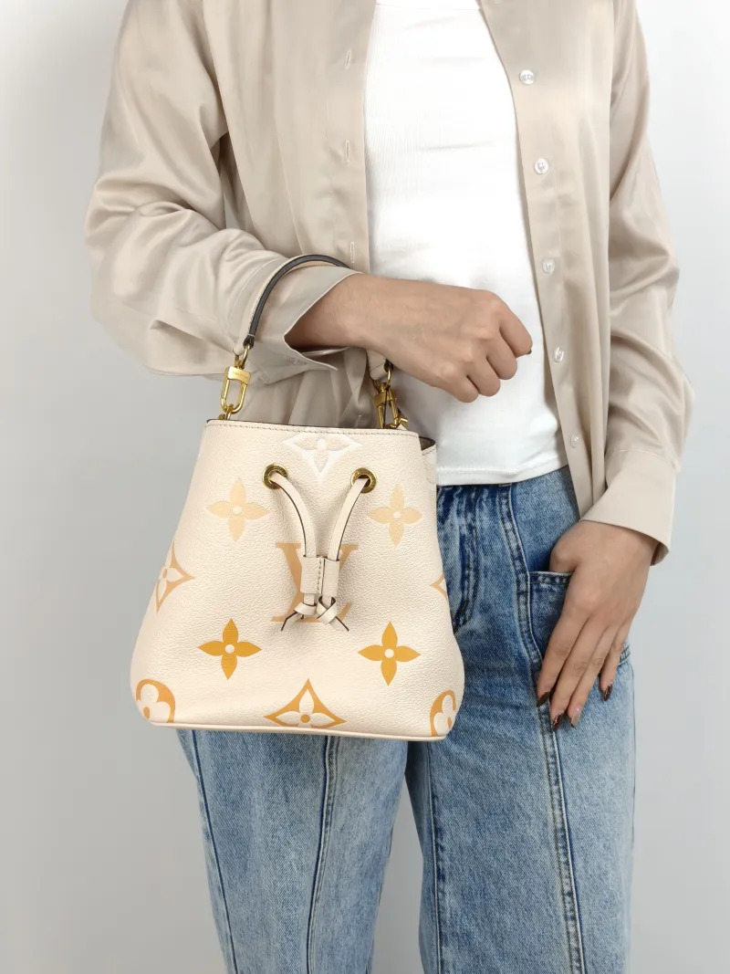 Louis Vuitton Crossbody Bag NÉONOÉ Bucket Bag BB Monogram Empreinte Embossed Calfskin BB 20 × 13 × 20 cm Conditioned — on-model view 3 of 3