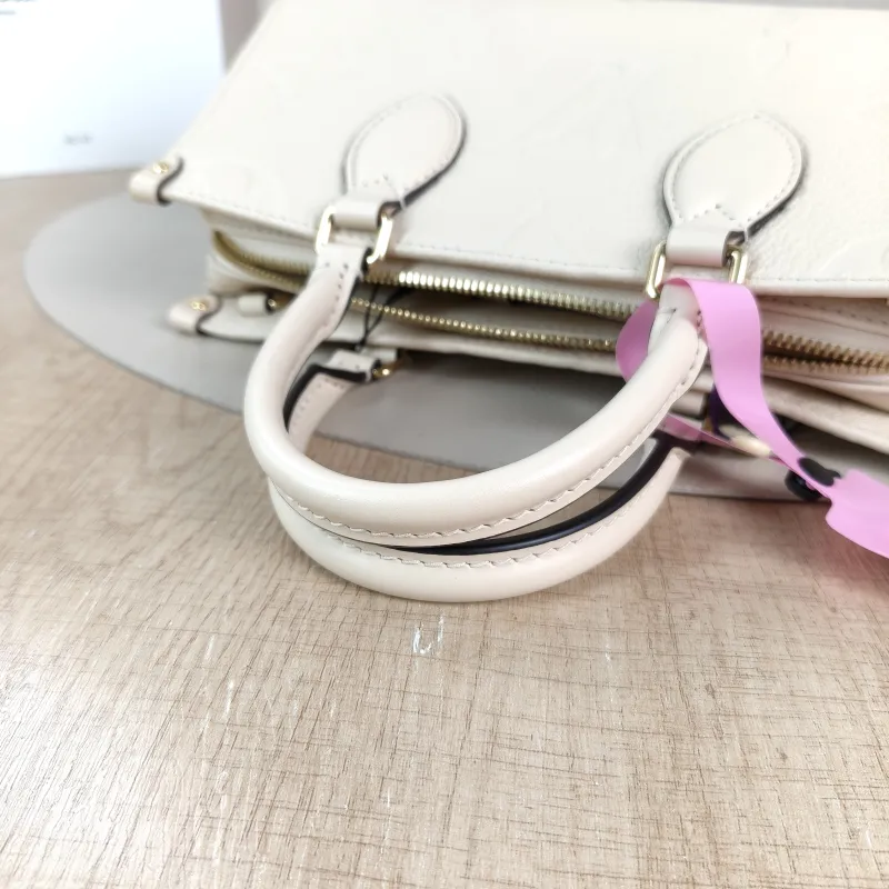 Louis Vuitton Crossbody Bag Onthego East West Two Straps White Empreinte Embossed Calfskin Small 25 × 10 × 13 cm — detail view 5 of 13