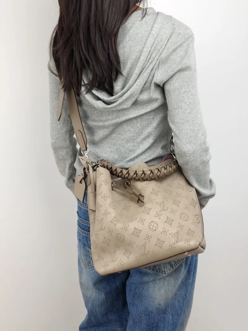 Louis Vuitton Shoulder Bag Muria Grey Calfskin One Size 26 × 14 × 26 cm — on-model view 3 of 3