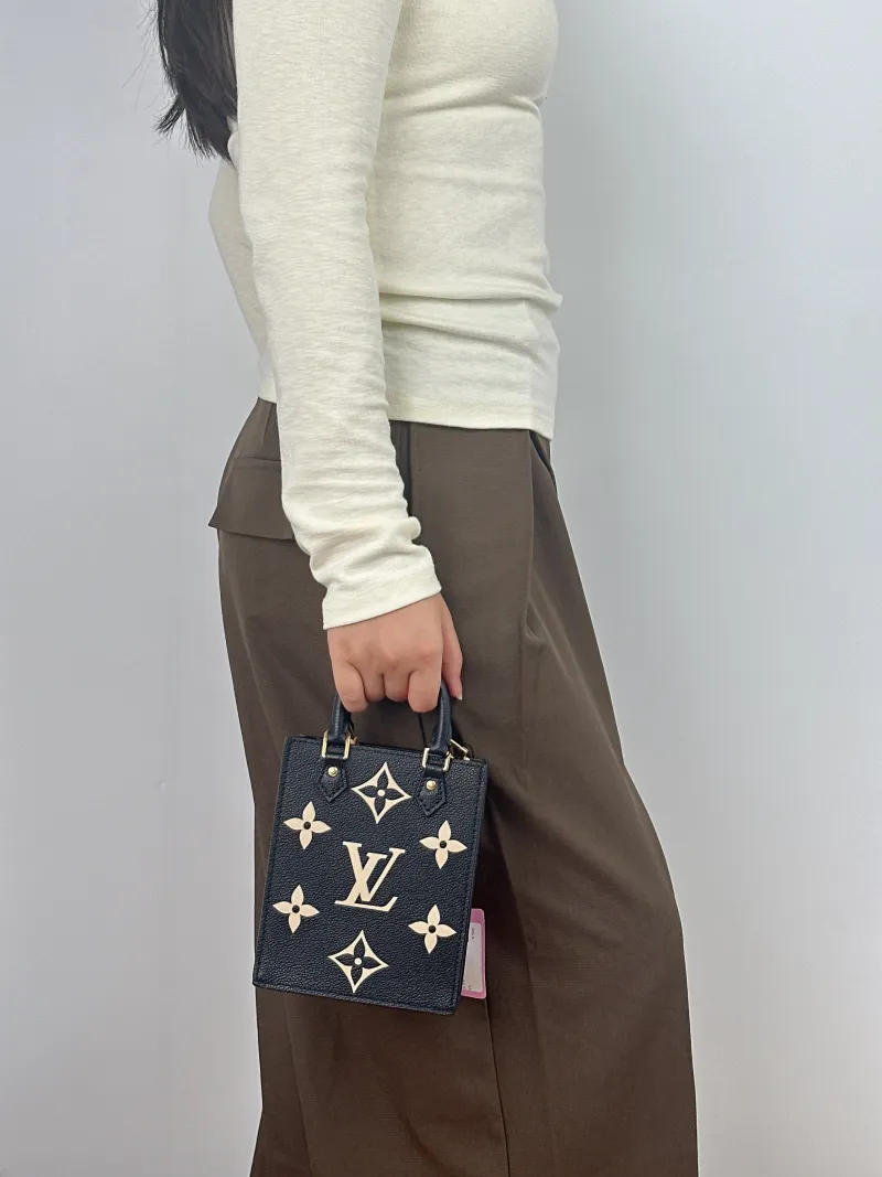 Louis Vuitton Crossbody Bag PETIT SAC PLAT Mini Calfskin Mini 14 × 5 × 17 cm — on-model view 1 of 2