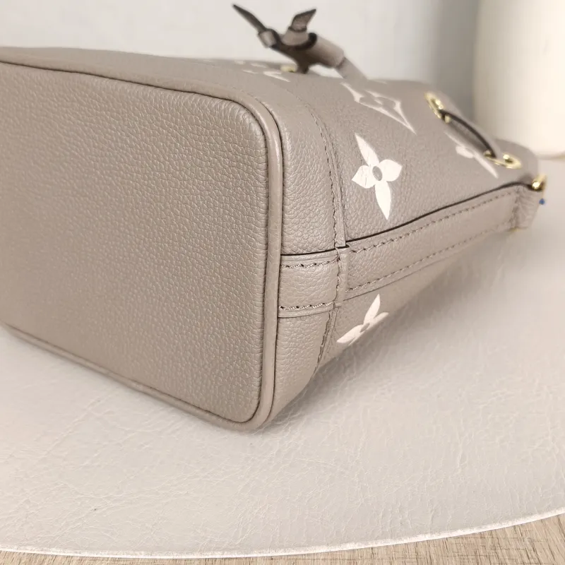 Louis Vuitton Crossbody Bag NANO NOÉ Bucket Bag Nano · White Monogram Empreinte Embossed Calfskin nano 13 × 10 × 16 cm — detail view 1 of 11